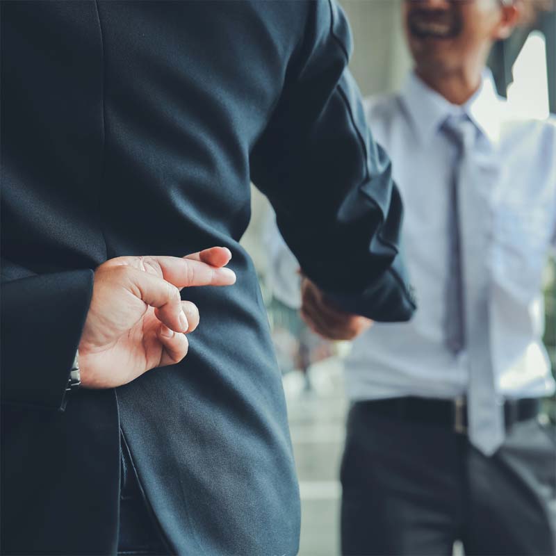 Untrustworthy business deal with crossed fingers gesture