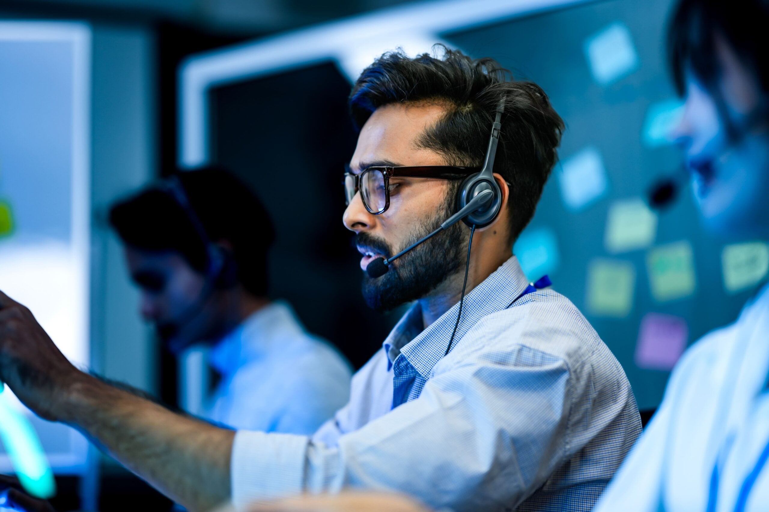A person wearing an headset while providing interpretation services virtually.