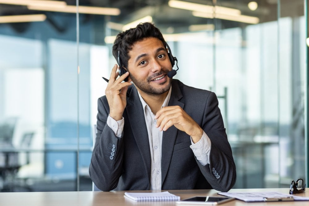 Professional interpreter providing interpreting and translation services during a business meeting, supporting multilingual communication and language access solutions.