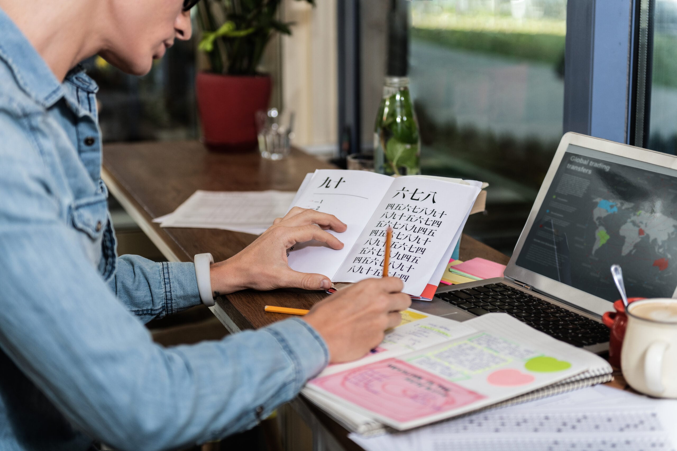 A young man going through a written document.