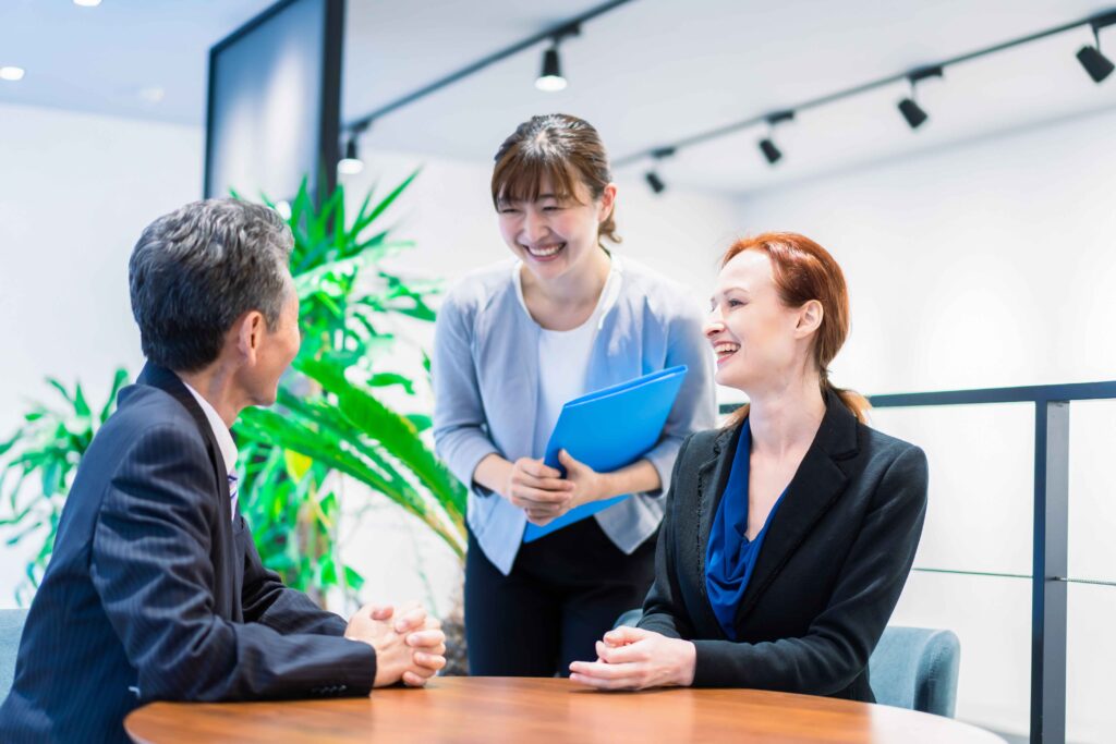 Business professionals discussing during a formal meeting with a Polish interpreter