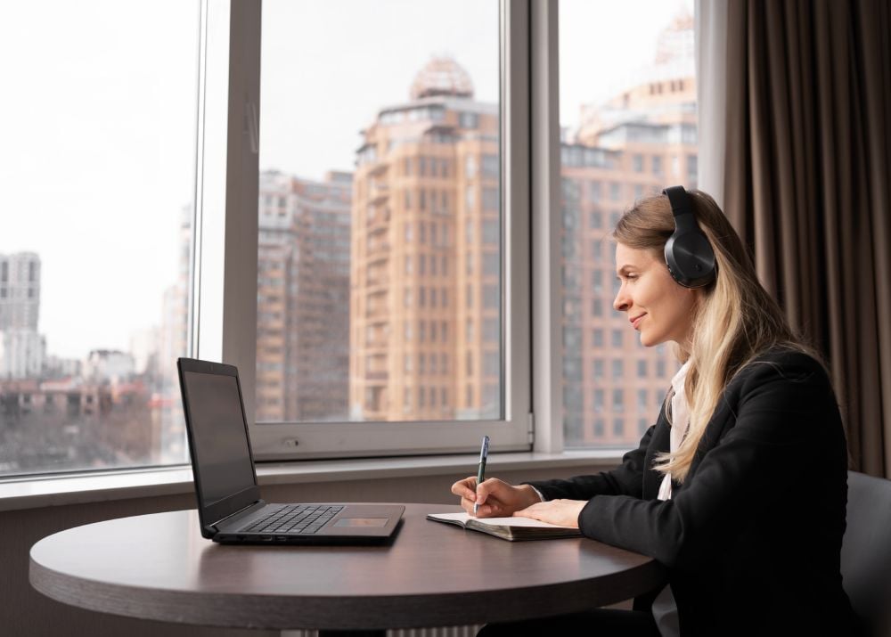 Zoom Interpretation Service with a professional interpreter providing remote language support through a laptop.