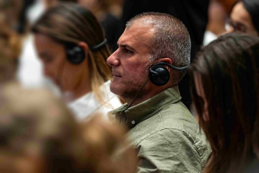 On-site conference interpretation: attendees listen through interpreting headsets at an event