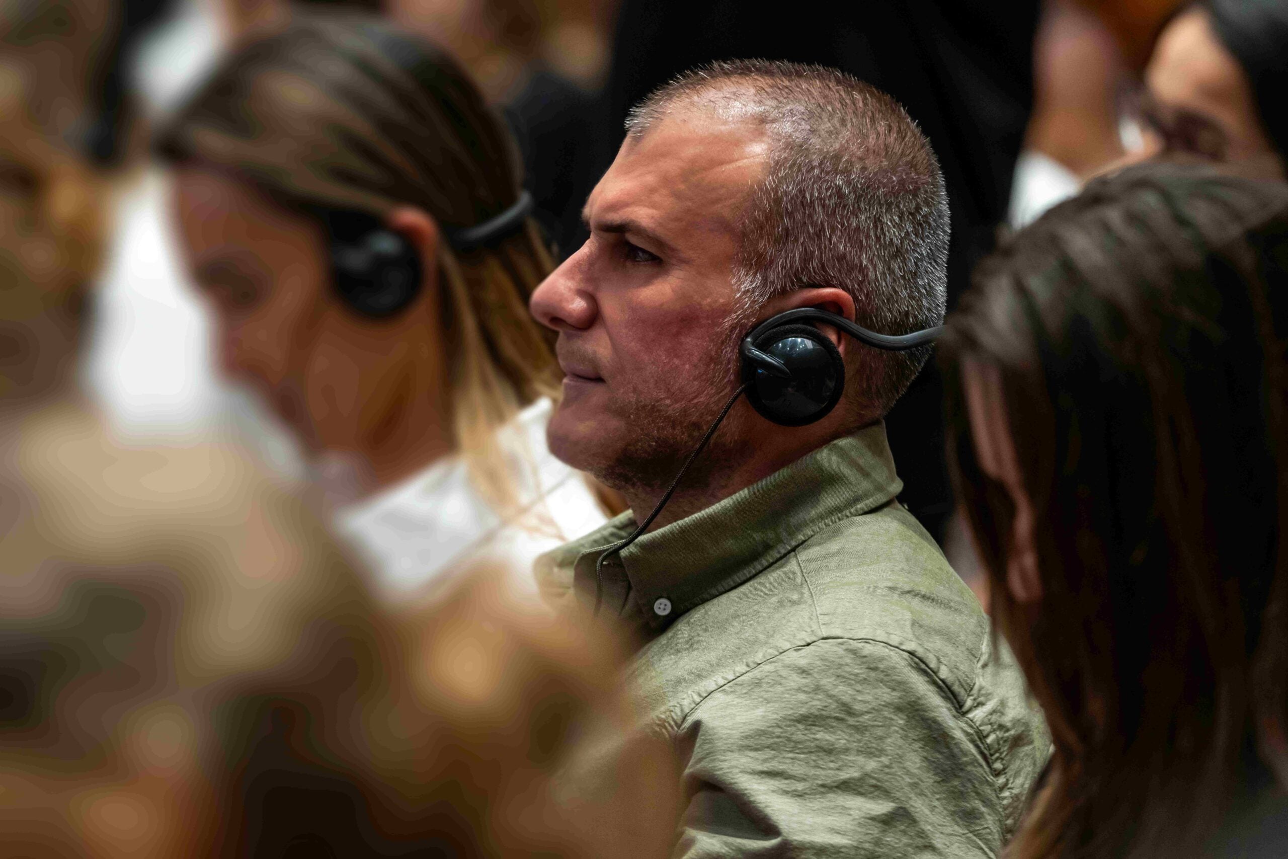 On-site conference interpretation: attendees listen through interpreting headsets at an event