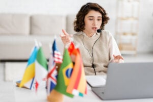 a-woman-wearing-a-headset-and-discussing-on-the-desk